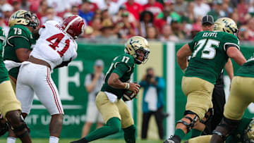 Sep 16, 2023; Tampa, Florida, USA;  South Florida Bulls quarterback Byrum Brown (17) runs with the ball against the Alabama Crimson Tide in the first quarter at Raymond James Stadium. Mandatory Credit: Nathan Ray Seebeck-Imagn Images