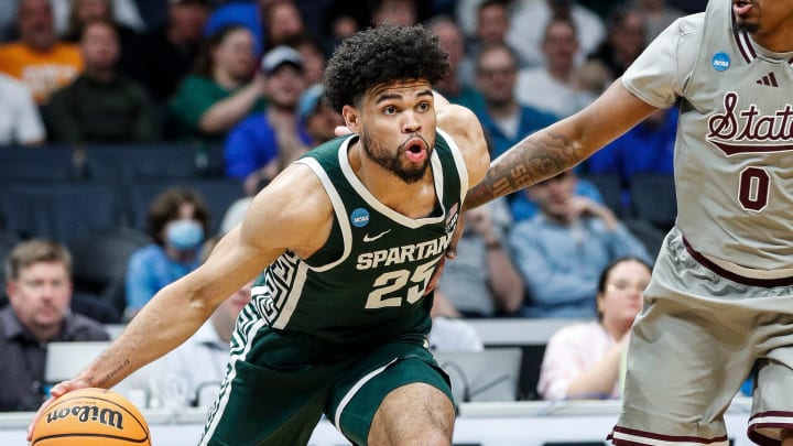 Michigan State forward Malik Hall (25) drives against Mississippi State forward D.J. Jeffries (0) during the first half of NCAA tournament West Region first round at Spectrum Center in Charlotte, N.C. on Thursday, March 21, 2024.