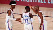 Aug 24, 2020; Lake Buena Vista, Florida, USA; Oklahoma City Thunder guard Chris Paul (right) talks with guard Shai Gilgeous-Alexander (left) and guard Dennis Schroder (17) during the first half in game four of the first round of the 2020 NBA Playoffs against the Houston Rockets at AdventHealth Arena. Mandatory Credit: Kim Klement-Imagn Images