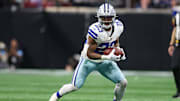 Nov 3, 2024; Atlanta, Georgia, USA; Dallas Cowboys running back Rico Dowdle (23) runs after a catch against the Atlanta Falcons in the fourth quarter at Mercedes-Benz Stadium. Mandatory Credit: Brett Davis-Imagn Images