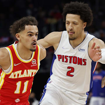 Mar 23, 2022; Detroit, Michigan, USA; (Editors Notes: Caption Correction) Atlanta Hawks guard Trae Young (11) dribbles against Detroit Pistons guard Cade Cunningham (2) in the first half at Little Caesars Arena. Mandatory Credit: Rick Osentoski-Imagn Images