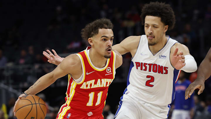 Mar 23, 2022; Detroit, Michigan, USA; (Editors Notes: Caption Correction) Atlanta Hawks guard Trae Young (11) dribbles against Detroit Pistons guard Cade Cunningham (2) in the first half at Little Caesars Arena. Mandatory Credit: Rick Osentoski-Imagn Images