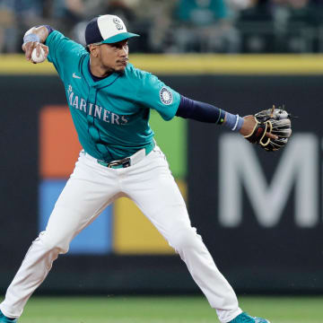 Seattle Mariners second baseman Jorge Polanco (7) throws to first on a play against the Minnesota Twins during the first inning at T-Mobile Park in 2024.