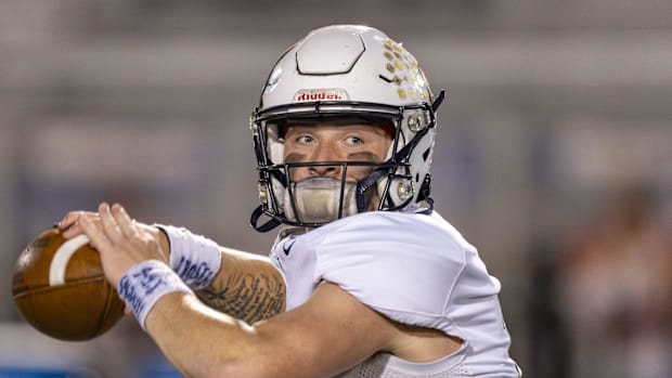 Decatur Central QB Bo Polston warms up on the field before the start of the 2024 IHSAA class 5A sectional championship.