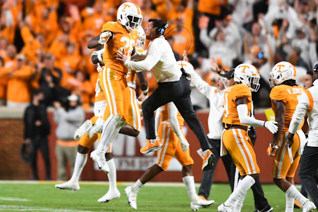 Tennessee defensive back Theo Jackson (26) reacts with Tennessee outside linebackers/special teams coach Mike Ekeler.