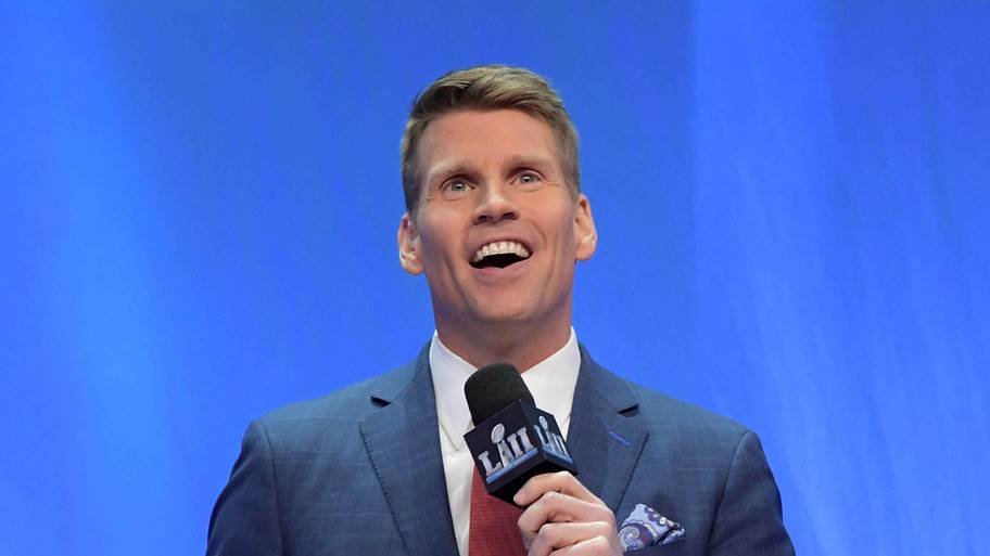 NFL Network broadcaster Scott Hanson speaks with the Lombardi trophy by his side during Super Bowl LII Opening Night.