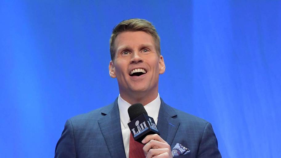 NFL Network broadcaster Scott Hanson speaks with the Lombardi trophy by his side during Super Bowl LII Opening Night