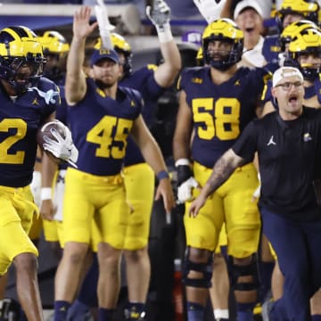 Aug 31, 2024; Ann Arbor, Michigan, USA;  Michigan Wolverines defensive back Will Johnson (2) runs the ball after he makes an interception in the second half against the Fresno State Bulldogs at Michigan Stadium. Mandatory Credit: Rick Osentoski-USA TODAY Sports