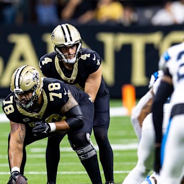 Sep 8, 2024; New Orleans, Louisiana, USA;  New Orleans Saints quarterback Derek Carr (4) calls for the ball from center Erik McCoy (78) against the Carolina Panthers during the first half at Caesars Superdome. Mandatory Credit: Stephen Lew-Imagn Images