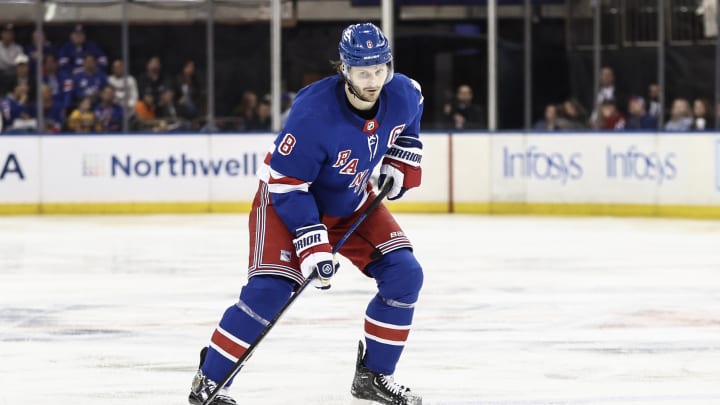 Apr 7, 2024; New York, New York, USA;  New York Rangers defenseman Jacob Trouba (8) controls the puck in the second period against the Montreal Canadiens at Madison Square Garden. Mandatory Credit: Wendell Cruz-USA TODAY Sports