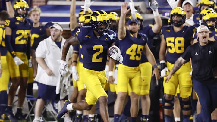 Aug 31, 2024; Ann Arbor, Michigan, USA;  Michigan Wolverines defensive back Will Johnson (2) runs the ball after he makes an interception in the second half against the Fresno State Bulldogs at Michigan Stadium. Mandatory Credit: Rick Osentoski-Imagn Images