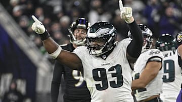 Dec 1, 2024; Baltimore, Maryland, USA;  Philadelphia Eagles defensive tackle Milton Williams (93) celebrates as Baltimore Ravens place kicker Justin Tucker (9) reacts to missing a second half field goal at M&T Bank Stadium. 