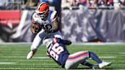 Oct 26, 2025; Foxborough, Massachusetts, USA;  Cleveland Browns running back Quinshon Judkins (10) runs with the ball against New England Patriots cornerback Marcus Jones (25) during the first quarter at Gillette Stadium. Mandatory Credit: Bob DeChiara-Imagn Images