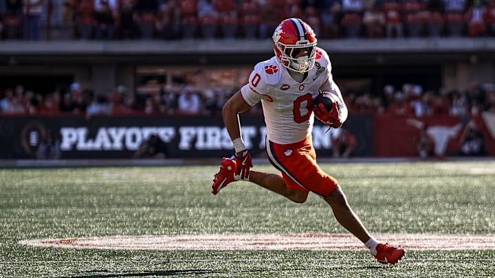 Dec 21, 2024; Austin, Texas, USA; Clemson receiver Antonio Williams (0) runs the ball   against the Texas Longhorns in the first round of the College Football Playoffs at Darrell K Royal-Texas Memorial Stadium. Mandatory Credit: Aaron E. Martinez/USA Today Network via Imagn Images