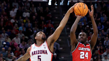 Mar 23, 2024; Salt Lake City, UT, USA; Arizona Wildcats guard KJ Lewis (5) blocks a shot by Dayton Flyers guard Kobe Elvis (24) during the second half in the second round of the 2024 NCAA Tournament at Vivint Smart Home Arena-Delta Center. 