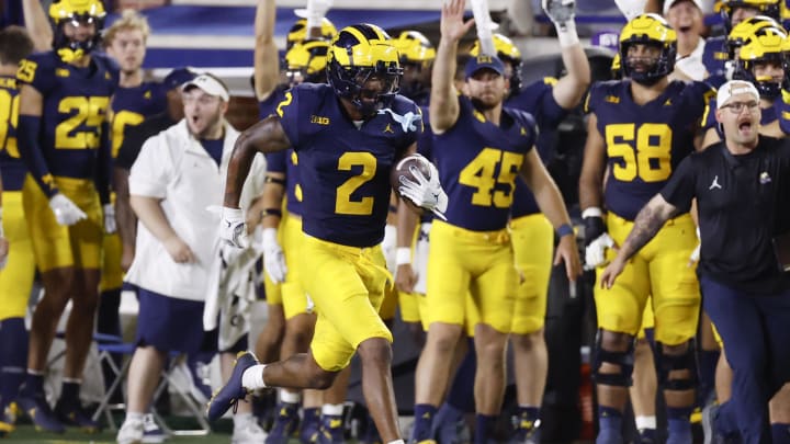 Aug 31, 2024; Ann Arbor, Michigan, USA;  Michigan Wolverines defensive back Will Johnson (2) runs the ball after he makes an interception in the second half against the Fresno State Bulldogs at Michigan Stadium.