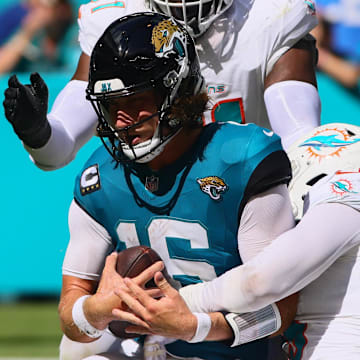 Sep 8, 2024; Miami Gardens, Florida, USA; Miami Dolphins linebacker Jaelan Phillips (15) sacks Jacksonville Jaguars quarterback Trevor Lawrence (16) during the fourth quarter at Hard Rock Stadium. Mandatory Credit: Sam Navarro-Imagn Images