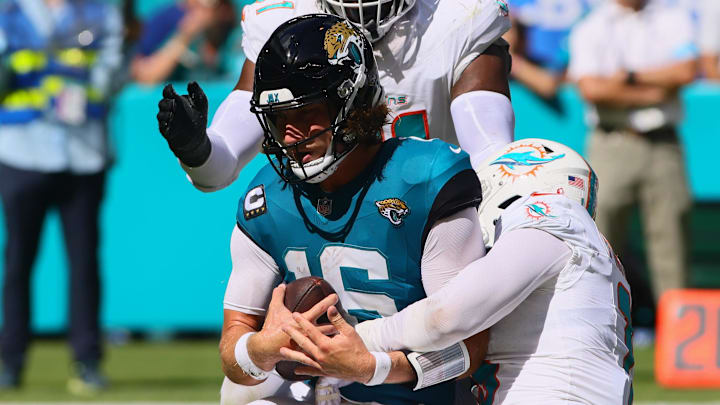 Sep 8, 2024; Miami Gardens, Florida, USA; Miami Dolphins linebacker Jaelan Phillips (15) sacks Jacksonville Jaguars quarterback Trevor Lawrence (16) during the fourth quarter at Hard Rock Stadium. Mandatory Credit: Sam Navarro-Imagn Images