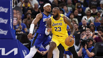 Mar 24, 2025; Orlando, Florida, USA; Los Angeles Lakers forward LeBron James (23) controls the ball against the Orlando Magic in the third quarter at Kia Center. Mandatory Credit: Nathan Ray Seebeck-Imagn Images
