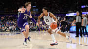 Dec 9, 2023; Seattle, Washington, USA; Gonzaga Bulldogs guard Ryan Nembhard (0) dribbles the ball while guarded by Washington Huskies forward Moses Wood (13) during the second half at Alaska Airlines Arena at Hec Edmundson Pavilion. Mandatory Credit: Steven Bisig-USA TODAY Sports