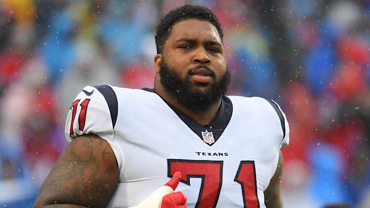 Houston Texans offensive tackle Tytus Howard jogging off the field.