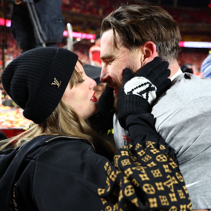 Taylor Swift and Kansas City Chiefs tight end Travis Kelce react after the AFC Championship game against the Buffalo Bills