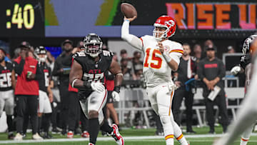 Sep 22, 2024; Atlanta, Georgia, USA; Kansas City Chiefs quarterback Patrick Mahomes (15) passes the ball behind Atlanta Falcons defensive tackle David Onyemata (90) during the second half at Mercedes-Benz Stadium. Mandatory Credit: Dale Zanine-Imagn Images