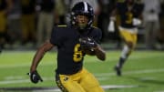 Colquitt County senior running back Charlie Pace (8) rushes the ball in a game against Lincoln on Sept. 28, 2022, at Mack Tharpe Stadium. The Packers won 30-7.

J9t4165