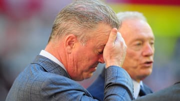 Dallas Cowboys executive vice president Stephen Jones (left) reacts alongside owner Jerry Jones before the game against the Arizona Cardinals at the University of Phoenix Stadium.