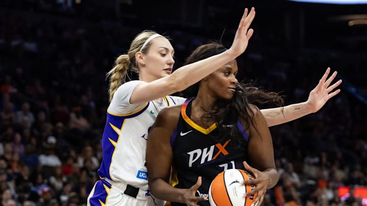Sep 9, 2025; Phoenix, Arizona, USA; Los Angeles Sparks forward Cameron Brink (22) defends against Phoenix Mercury center Kalani Brown (21) during a WNBA game at PHX Arena. Mandatory Credit: Mark J. Rebilas-Imagn Images