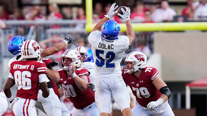 Buffalo linebacker Shaun Dolac (52) intercepts the ball during the fourth quarter of the game. Buffalo linebacker Shaun Dolac (52) intercepts the ball during the fourth quarter of the game.