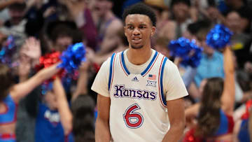 Jan 25, 2025; Lawrence, Kansas, USA; Kansas Jayhawks guard Rylan Griffen (6) celebrates after scoring against the Houston Cougars in overtime at Allen Fieldhouse. Mandatory Credit: Denny Medley-Imagn Images