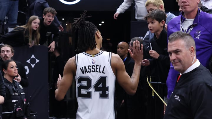 Mar 27, 2024; Salt Lake City, Utah, USA; San Antonio Spurs guard Devin Vassell (24) celebrates with fans after the game against the Utah Jazz at Delta Center. 