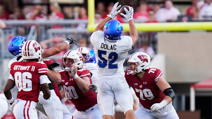 Buffalo linebacker Shaun Dolac (52) intercepts the ball 