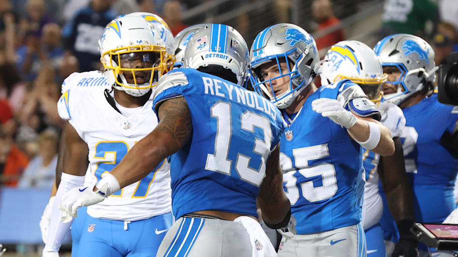 Detroit Lions running back Craig Reynolds (13) celebrates with teammates after scoring against the Los Angeles Chargers  | Charles LeClaire-Imagn Images