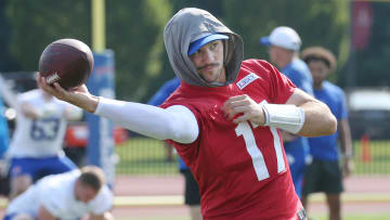 Bills quarterback Josh Allen warms up with throws along the sidelines as he takes the field during the opening day of Buffalo Bills training camp at St. John Fisher University Wednesday, July 24, 2024 in Pittsford.