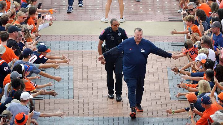 Sep 13, 2025; Champaign, Illinois, USA;  Illinois Fighting Illini head coach Bret Bielema leads his team down the Illini Walk before an NCAA game against the Western Michigan Broncos at Memorial Stadium. Mandatory Credit: Ron Johnson-Imagn Images