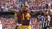 Sep 27, 2025; Minneapolis, Minnesota, USA;  Minnesota Golden Gophers defensive back Kerry Brown (14) celebrates his interception against Rutgers Scarlet Knights during the second quarter at Huntington Bank Stadium. Mandatory Credit: Nick Wosika-Imagn Images