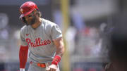 Jul 24, 2024; Minneapolis, Minnesota, USA;  Philadelphia Phillies infielder Bryce Harper reacts after taking a called third strike.