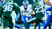 Los Angeles Rams running back Blake Corum (22) runs with the ball as he heads towards the Jets defense, Sunday, December 22, 2024.