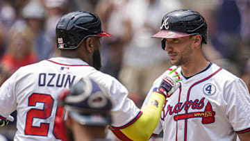 Jun 1, 2025; Cumberland, Georgia, USA; Atlanta Braves designated hitter Marcell Ozuna (20) reacts with first baseman Matt Olson (28) after hitting a home run against the Boston Red Sox during the first inning at Truist Park. Mandatory Credit: Dale Zanine-Imagn Images