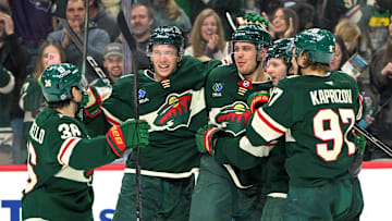 Apr 9, 2025; Saint Paul, Minnesota, USA;  Minnesota Wild forward Joel Eriksson Ek (14) celebrates with forward Mats Zuccarello (36), forward Joel Eriksson Ek (14), forward Marco Rossi (23) and forward Kiril Kaprizov (97) after completing a hat trick on a power play goal against the San Jose Sharks during the third period at Xcel Energy Center. Mandatory Credit: Nick Wosika-Imagn Images