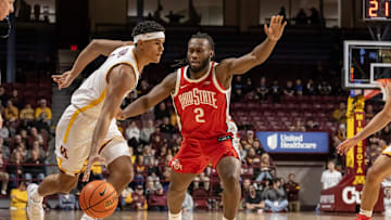 Jan 6, 2025; Minneapolis, Minnesota, USA;  Minnesota Golden Gophers guard Isaac Asuma (1) controls the ball as Ohio State Buckeyes guard Bruce Thornton (2) defends during the first half at Williams Arena. Mandatory Credit: Nick Wosika-Imagn Images