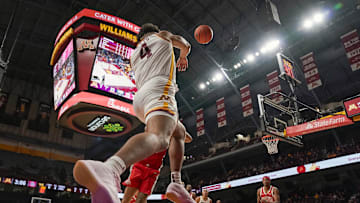 Jan 6, 2025; Minneapolis, Minnesota, USA;  Minnesota Golden Gophers forward Kadyn Betts (4) saves the ball from going out of bounds against the Ohio State Buckeyes during the first half at Williams Arena. Mandatory Credit: Nick Wosika-Imagn Images
