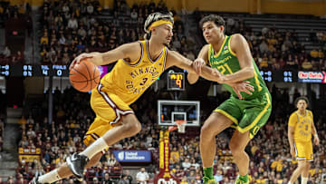 Jan 25, 2025; Minneapolis, Minnesota, USA;  Minnesota Golden Gophers forward Dawson Garcia (3) controls the ball as Oregon Ducks forward James Cooper (12) defends during the first half at Williams Arena. Mandatory Credit: Nick Wosika-Imagn Images