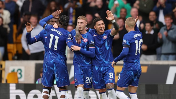 Chelsea players celebrate after scoring against Wolves.