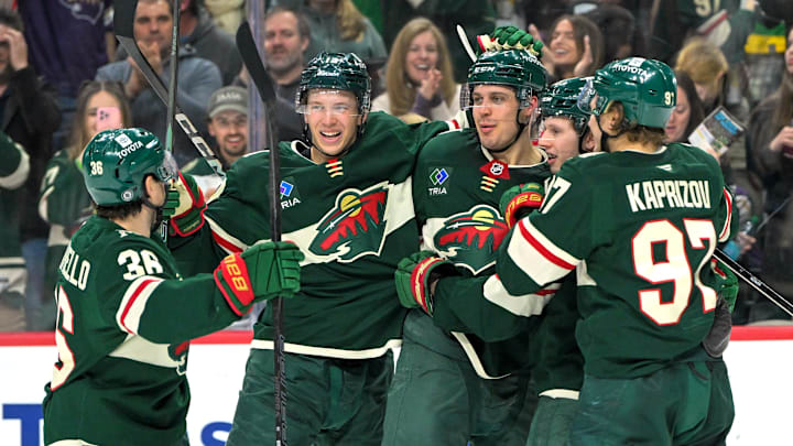 Apr 9, 2025; Saint Paul, Minnesota, USA;  Minnesota Wild forward Joel Eriksson Ek (14) celebrates with forward Mats Zuccarello (36), forward Joel Eriksson Ek (14), forward Marco Rossi (23) and forward Kiril Kaprizov (97) after completing a hat trick on a power play goal against the San Jose Sharks during the third period at Xcel Energy Center. Mandatory Credit: Nick Wosika-Imagn Images