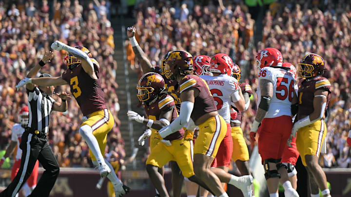 Sep 27, 2025; Minneapolis, Minnesota, USA; Minnesota Golden Gophers defensive back Koi Perich (3) celebrates his sack of Rutgers Scarlet Knights quarterback Athan Kaliakmanis (16) as teammates look on during the second quarter at Huntington Bank Stadium. Mandatory Credit: Nick Wosika-Imagn Images Sep 27, 2025; Minneapolis, Minnesota, USA; Minnesota Golden Gophers defensive back Koi Perich (3) celebrates his sack of Rutgers Scarlet Knights quarterback Athan Kaliakmanis (16) as teammates look on during the second quarter at Huntington Bank Stadium. Mandatory Credit: Nick Wosika-Imagn Images