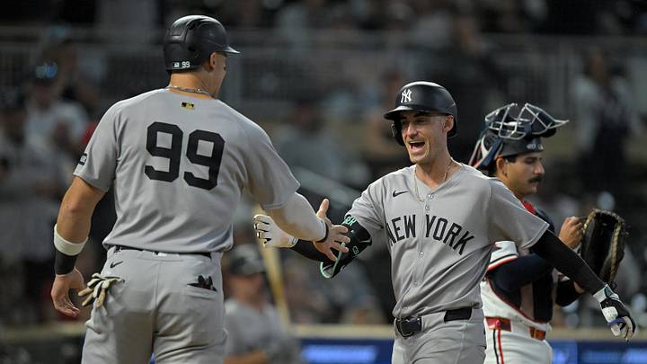 Sep 17, 2025; Minneapolis, Minnesota, USA;  New York Yankees designated hitter Aaron Judge (99) congratulates outfielder Cody Bellinger (35) on his two-run home run against the Minnesota Twins during the ninth inning at Target Field. Mandatory Credit: Nick Wosika-Imagn Images

