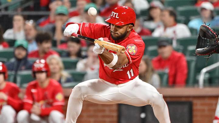 Apr 10, 2026; St. Louis, Missouri, USA;  St. Louis Cardinals center fielder Victor Scott II (11) bunts against the Boston Red Sox in the eighth inning at Busch Stadium. Mandatory Credit: Tim Vizer-Imagn Images
